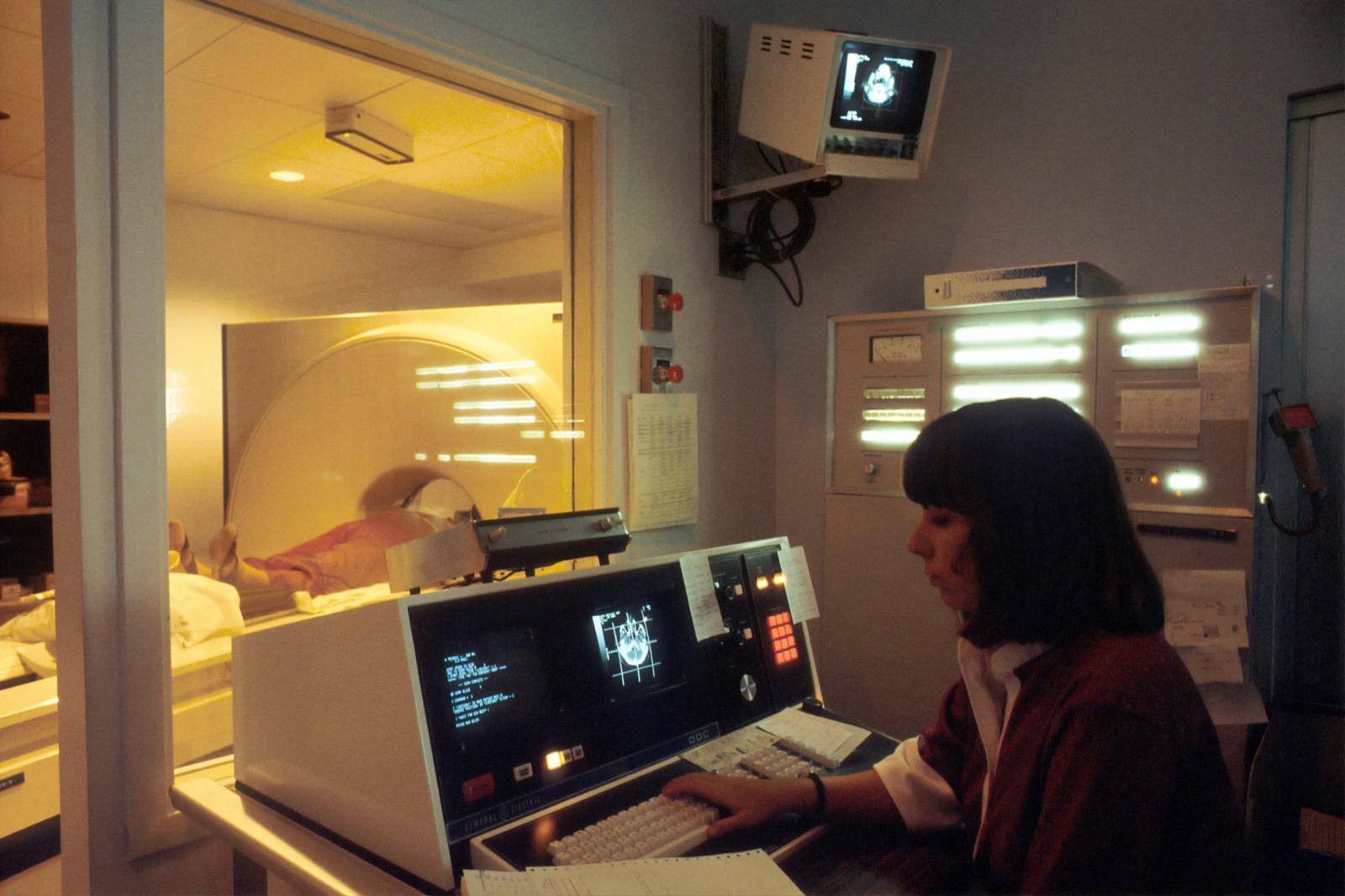 Radiologist reviewing cross-sectional imaging