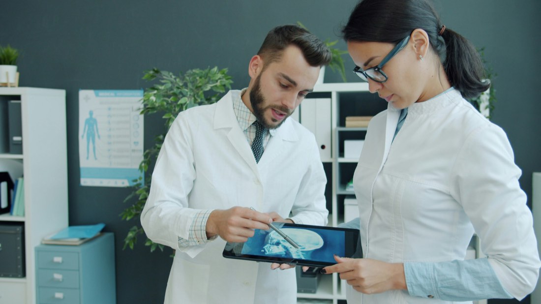 Doctors reviewing a medical scan for future body-specific imaging agents